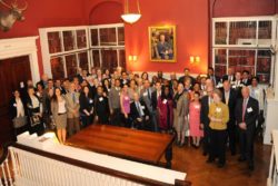 Photograph of people at May 3, 2013 Harvard Club dinner thanking all of the faculty, staff, and students who had worked with the central office on Pathways